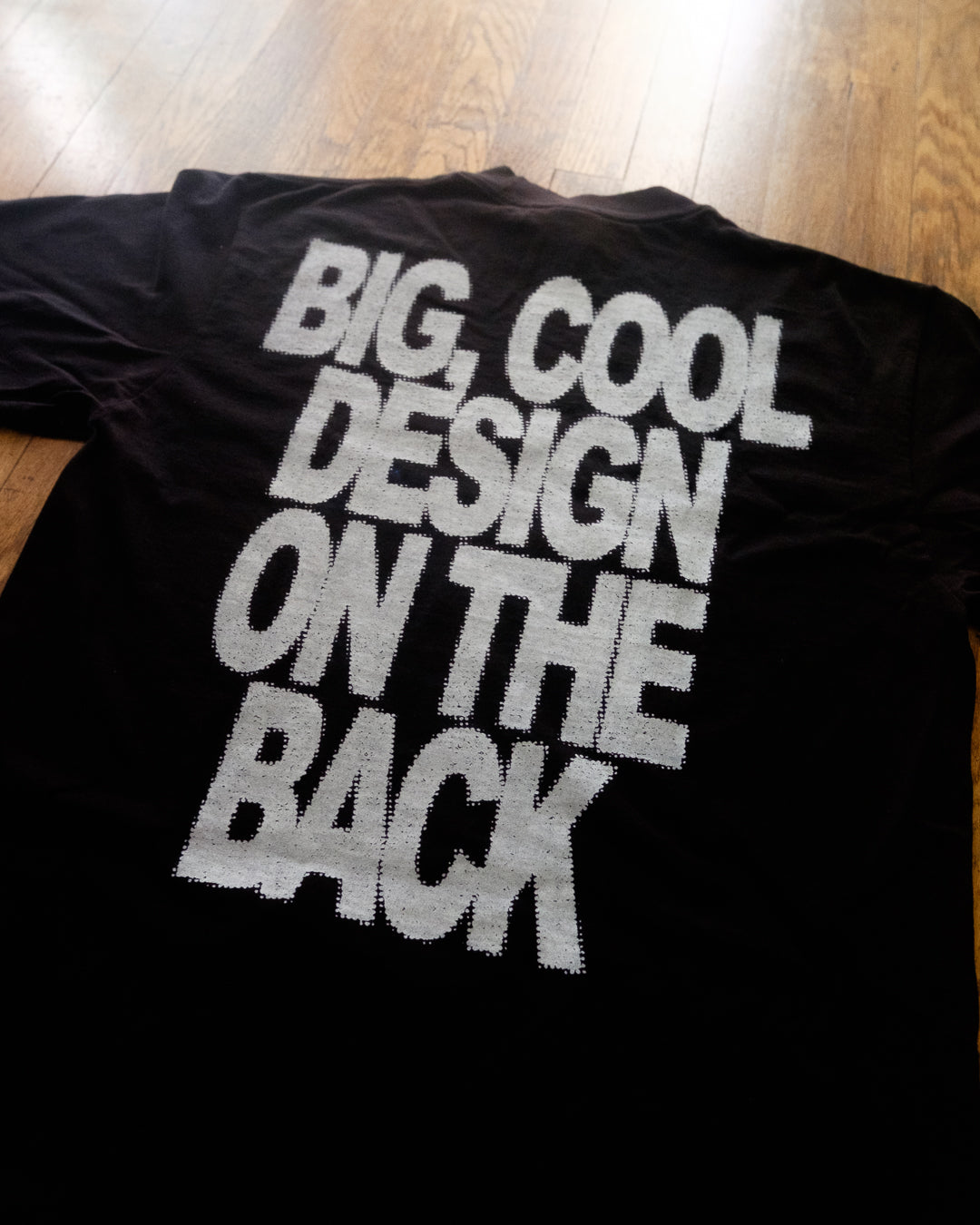 Small Left Chest Design Big Cool Design on the Back T-Shirt